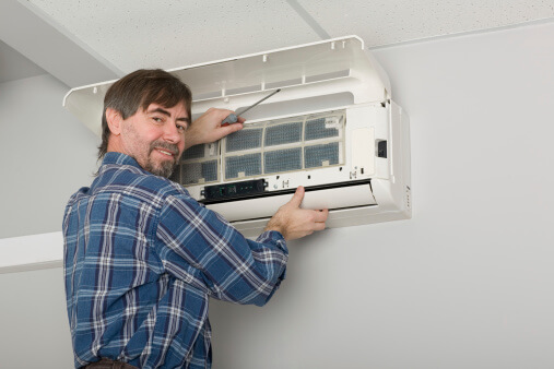 Technician working on a ductless unit.
