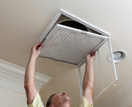 technician installing air filter