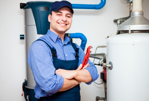 Technician servicing a hybrid hot water heater