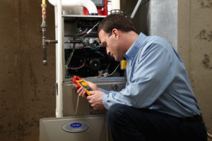Technician repairing a heating system