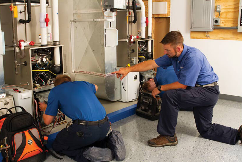 hvac technicians troubleshooting a system