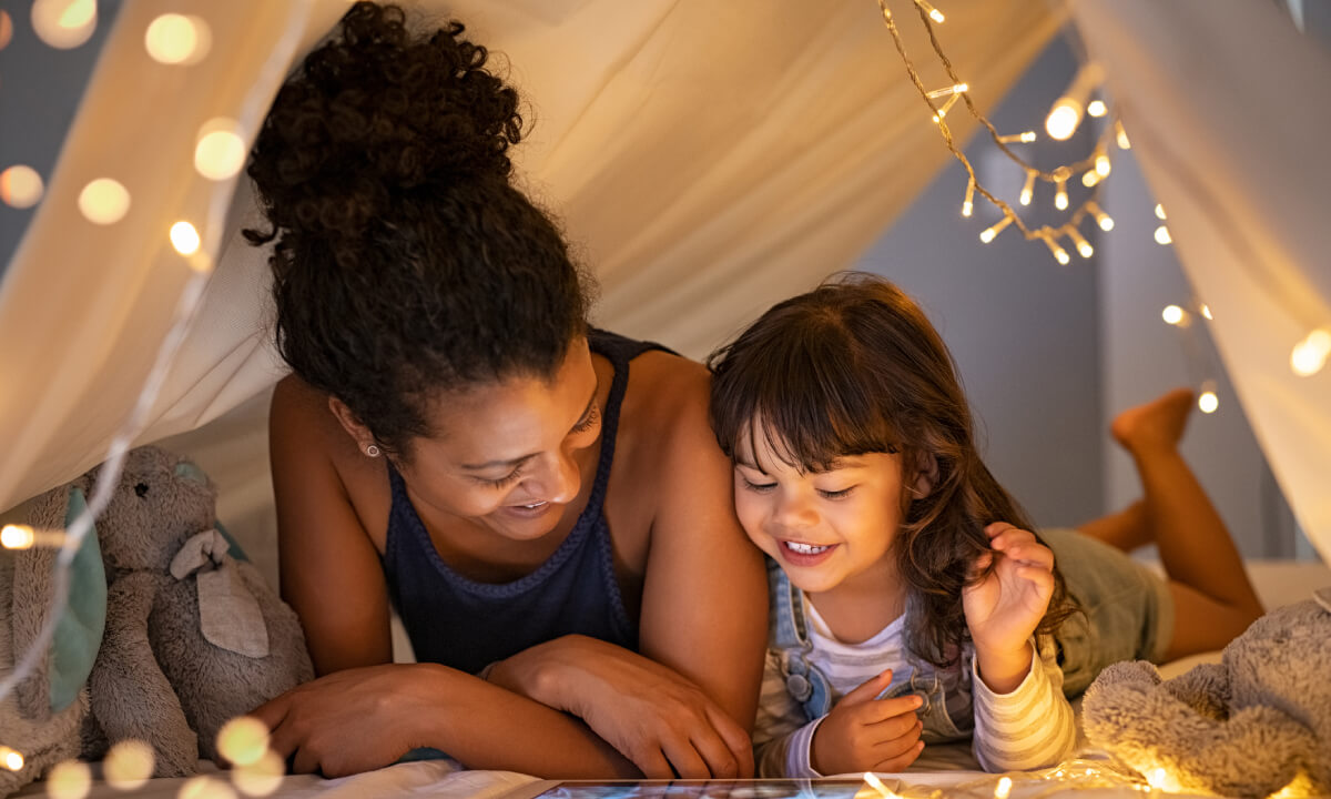 mother and daughter watching a movie