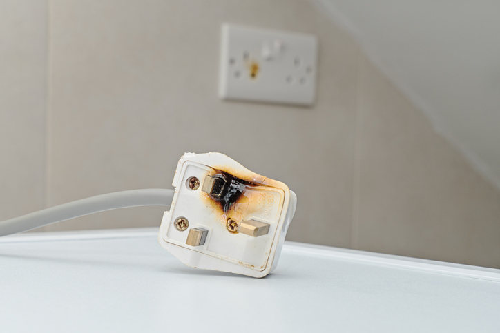 Burned socket from improper use of AC Power Plugs and Sockets cause of short circuit and fires at home. A whole house surge protector will help prevent damages to outlet and plug