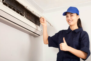 female hvac technician giving thumbs up