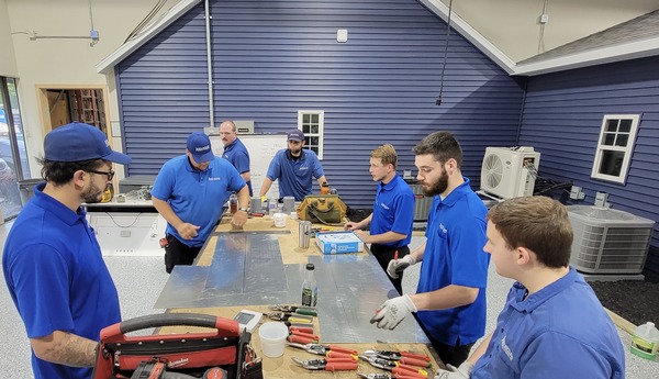 John Betlem apprentices in training center