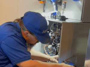 hvac technician working on system