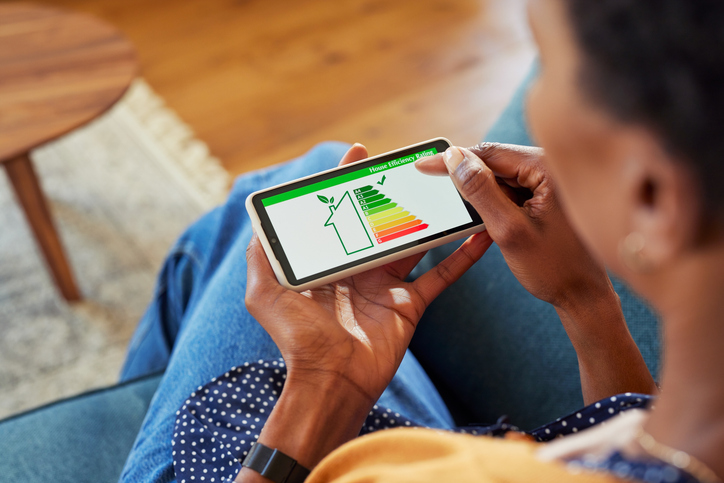 Woman checking the energy efficiency of her home