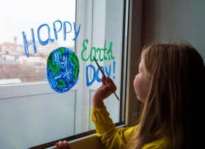 young girl drawing Earth Day art