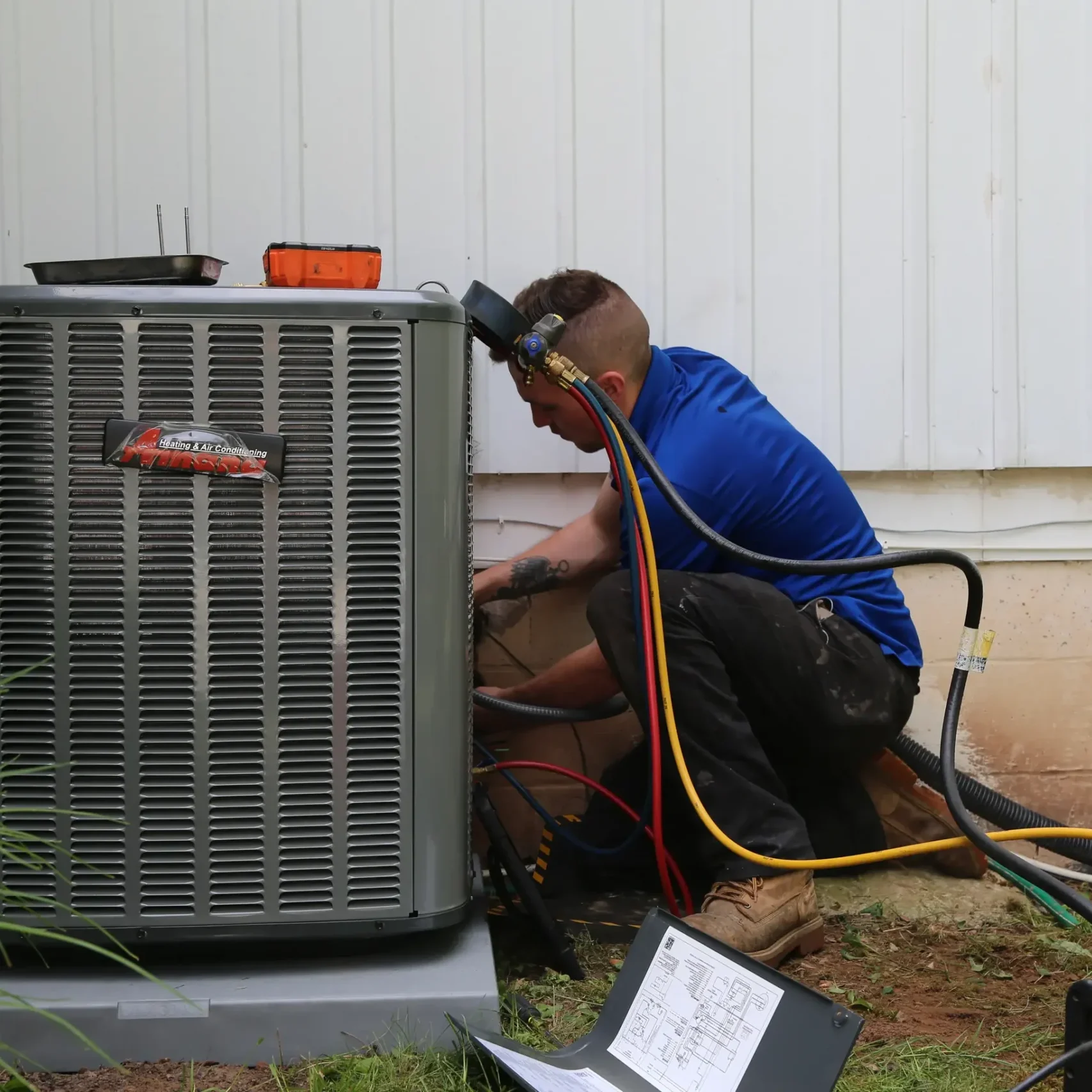 Amana system Technician servicing HVAC system