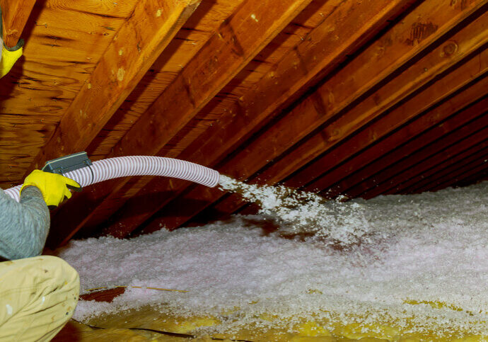 john betlem insulation installer blowing insulation in attic