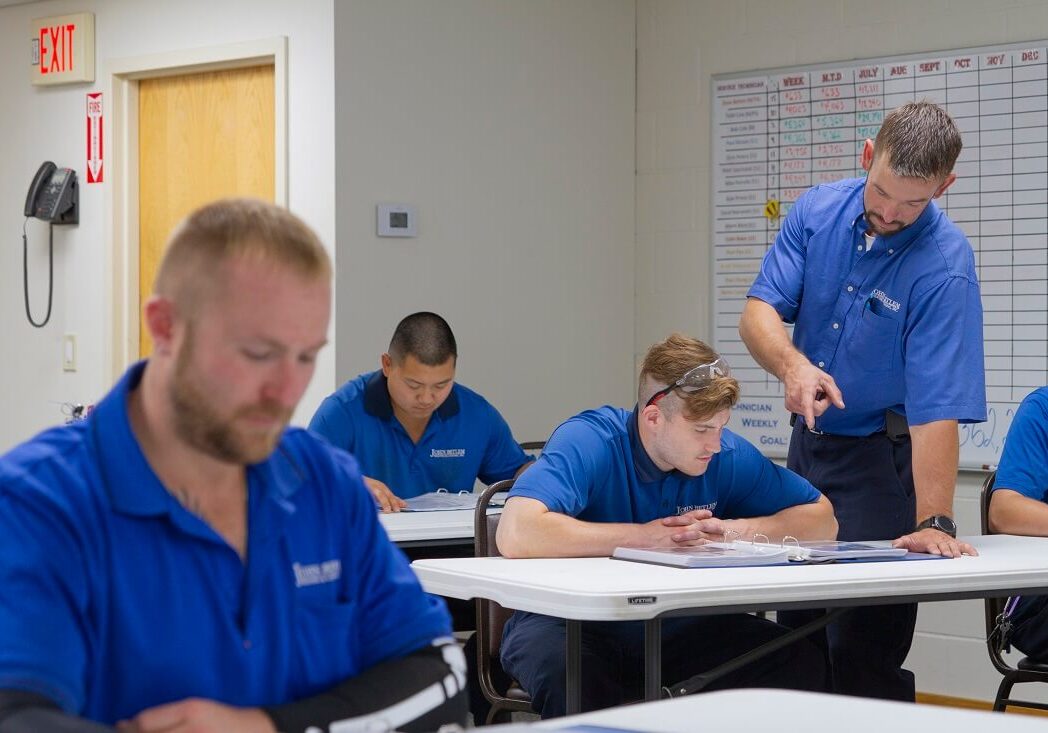 john betlem training facility technicians learning in John Betlem HVAC's training facility